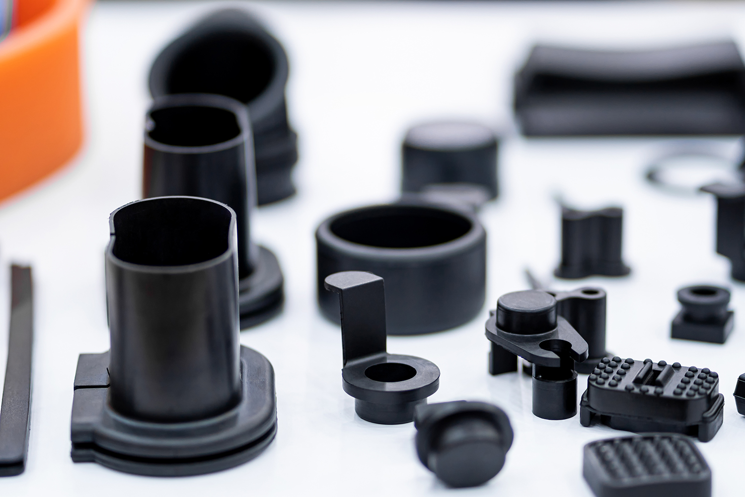 A number of black rubber molded gaskets on display