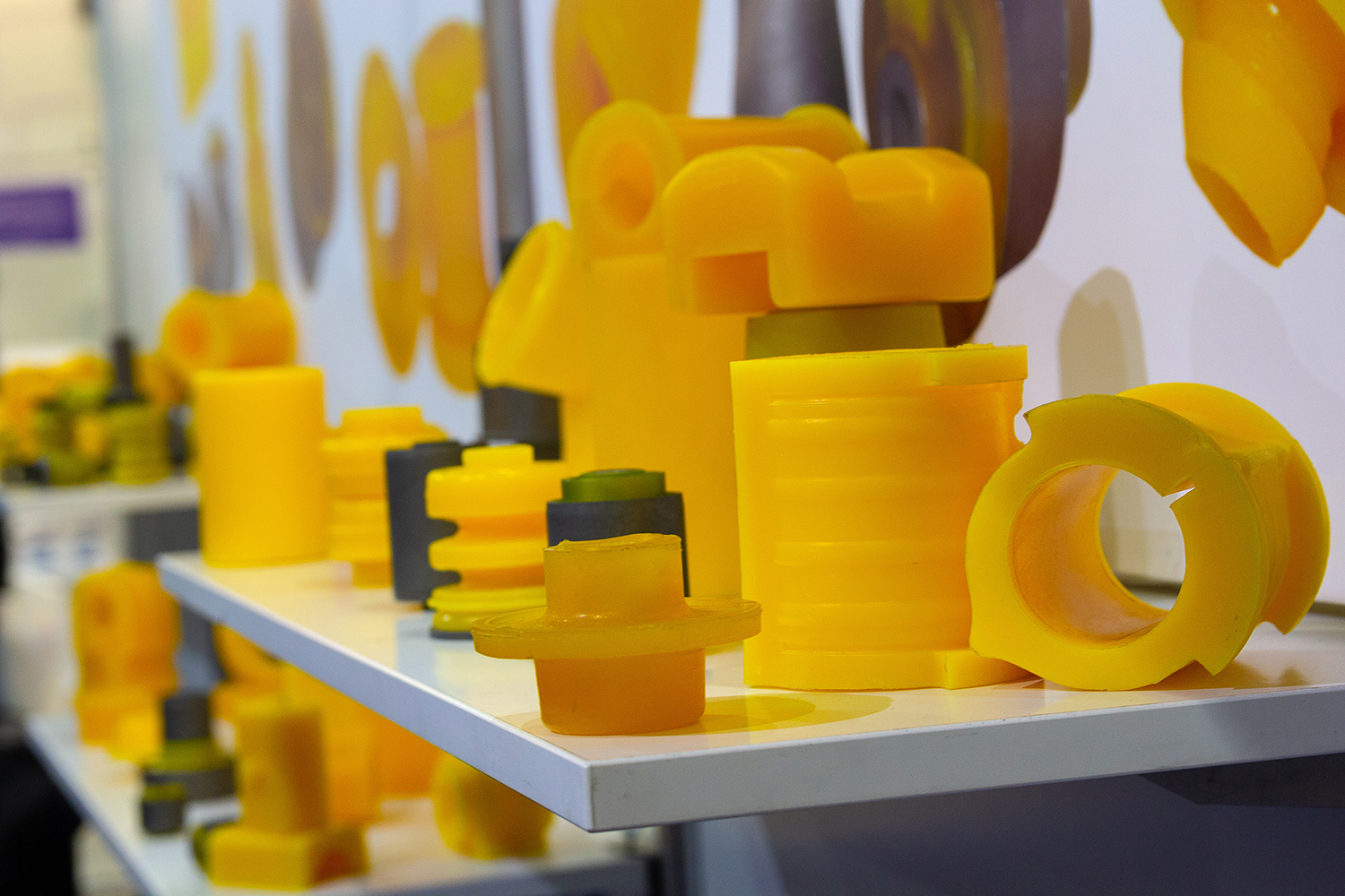 A display of yellow urethane and polyurethane gaskets and other items.