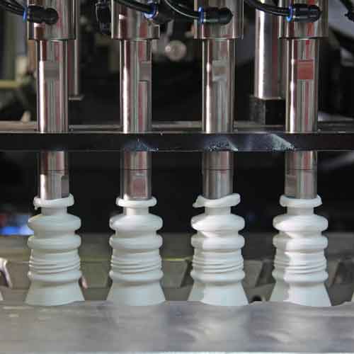 Three white blow molds being made