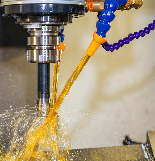 The CNC milling machine cutting the mold parts with oil coolant method.