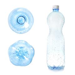 A plastic water bottle to the right with the bottom of two different bottle types to the left.