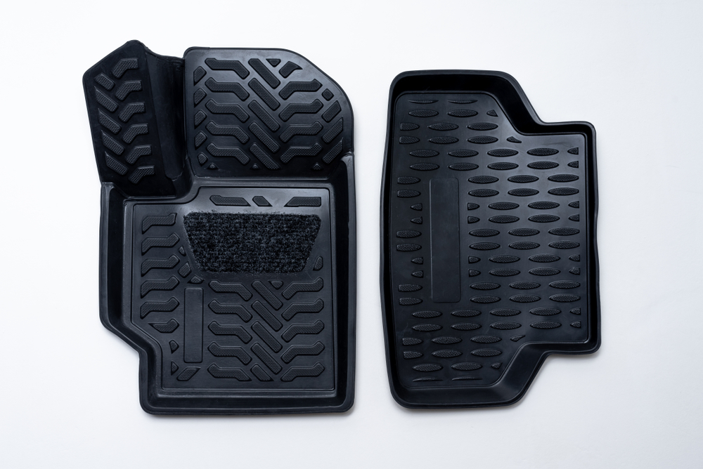 A black set of car mats made of thermoplastic elastomer.